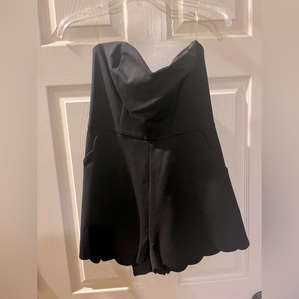 Black sleeveless romper, scalloped trim, large